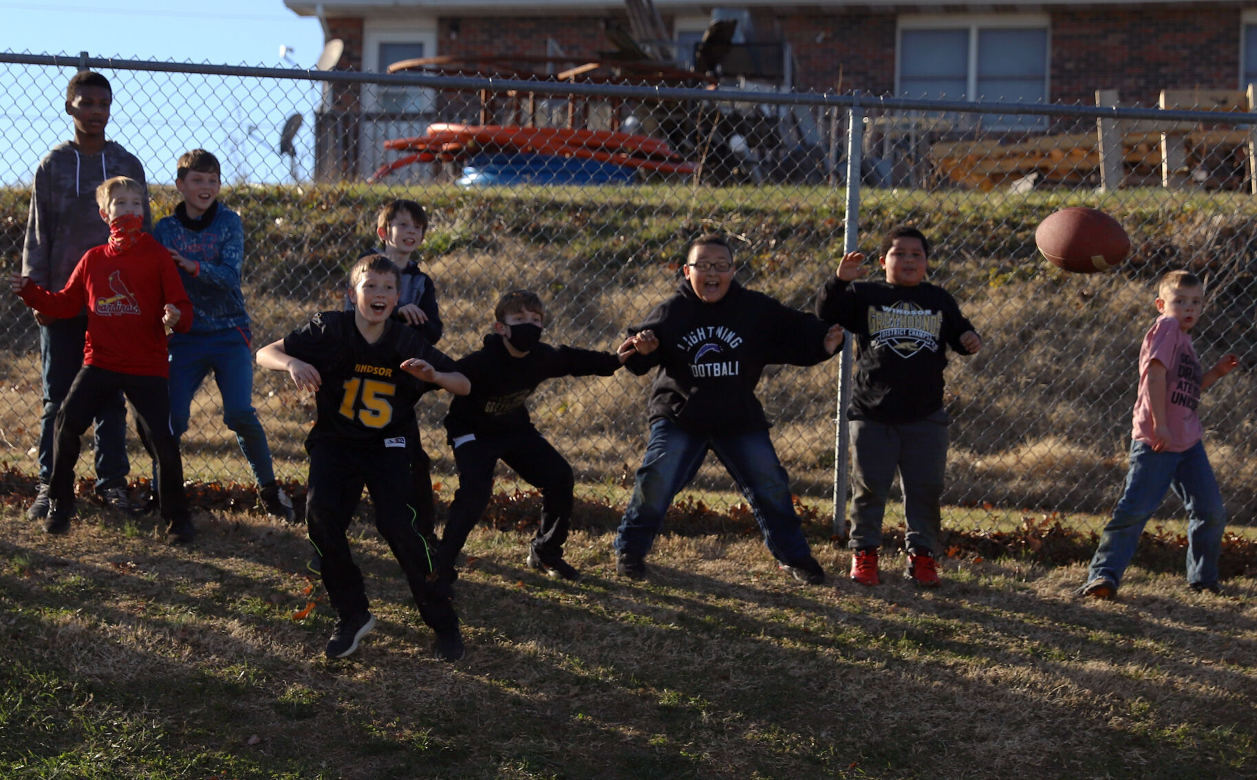 Children play with a football during halftime